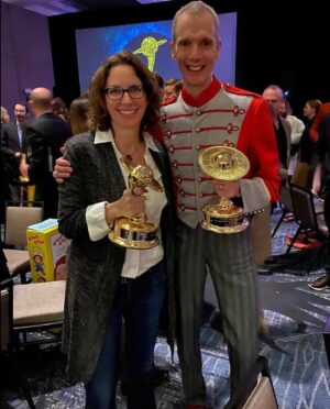 Doug Jones Instagram - Thank you @saturnawards for blessing me with another statuette for Best Supporting Actor in a TV Series, AND for blessing our show @startrek Discovery with Best Science Fiction Series (see photo with our divine showrunner Michelle Paradise)
.
My outfit: A 1980’s marching band uniform jacket, early 1900’s steampunk trousers, and 1970’s disco shoes, thanks to thrift stores and @clockwork_ctr ).
.
#saturnawards #saturnawards2021 #awardshow #award #startrek #startrekdiscovery #saru #kelpien #alien #actor #actorslife