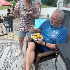 Drew Lynch Instagram - This post might be sappier than usual, so I apologize. 

I flew home to surprise my parents for the 4th this year. I hope this video shows how much it means to my family that we got to be together in light of my dad’s situation. I’m grateful for any holiday that gives me an excuse to spend time with them. Here’s a very special PHOTO LOCOMOTIVE below... 

1) The moment my parents came home to find us all together. 
2) My brother holding a flame torch while I held incense that I thought was a sparkler. 
3) Let’s blow sh*t up. 
4) I grew up on hose water
5)‘Merica 
6) Sister and dad ❤️
7) American independence with a little French 
8) Spike ball 
9) Couple-o-Indiana boys 
10) Mom and Dad watching the fireworks together 🫶🏼