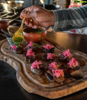 Eduardo Garcia Instagram - HOLIDAY TABLE with @chefeduardogarcia: Elk Tongue Sliders with Sauerkraut & Chimichurri.

Oh, the tongue, you noble muscle you. Functional in every breath, taste and experience the tongue is unavoidable. And yet little celebrated and rarely seen is the tongue on our modern fare. For me, Tongue is royalty amongst the big animals I harvest. Only one per animal. Versatile and equally toothsome eaten raw as a tartare, smoked, pickled, or slow cooked as I do here. Tongue is downright on par for its unctuous mouthfeel as Bluefin tuna belly in my humble opinion.

Elk Tongue Sliders: 

2 Elk tongues, or any other ungulate tongue 
1 ½ gallons water, divided 
8 oz @montanamex Habanero sauce, substitute with 8 oz tomato puree 
1 white onion, halved laterally between top and tail 
1 head garlic, smashed and most loose paper discarded 
1 Tablespoon Mexican oregano 
4 bay leaf 
2 teaspoon black peppercorns, lightly cracked 
2 teaspoons sea salt 

Sauerkraut: 

5 pounds red/purple cabbage, about 2 small heads 
2 pounds green cabbage, about 1/2 a large head 
2 large carrots 
8 cloves garlic 
1/4 cup plus 1 1/2 teaspoons sea salt 
1/2 teaspoon caraway seed 

Chimichurri: 

1/2 cup chopped Italian parsley 
1 tablespoon freshly squeezed lemon juice, from 1/2 a lemon 
1/3 cup extra virgin olive oil 
1/4 cup chopped cilantro 
1 tablespoon chopped oregano 
2 tablespoons capers, drained 
1/3 teaspoon kosher salt 
½ teaspoon @montanamex Jalapeño seasoning 

Full recipe from the link in bio. 
_
📷: @chefeduardogarcia
#mysteryranch #builtforthemission