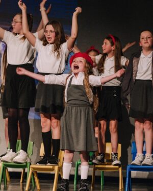 Ella Chadwick Instagram - Some photos from @tracingsteps #matilda show last week. I loved being red beret girl ❤️ 1st photo was taken by @nessworthyphoto @popsiclephotography and i love it thanks for capturing that pic❤️ and big thanks to those from the film matilda that took part in the special video message i suprised everybody with we shown it them just before the show and they all screamed and cheered 🎉🎉 #matilda #performance #middletonarena #musical #tracingsteps #tracingstepsshow  #redberetgirl