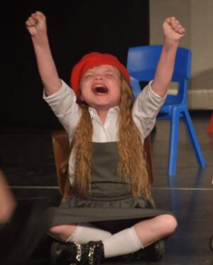 Ella Chadwick Instagram - Some photos from @tracingsteps #matilda show last week. I loved being red beret girl ❤️ 1st photo was taken by @nessworthyphoto @popsiclephotography and i love it thanks for capturing that pic❤️ and big thanks to those from the film matilda that took part in the special video message i suprised everybody with we shown it them just before the show and they all screamed and cheered 🎉🎉 #matilda #performance #middletonarena #musical #tracingsteps #tracingstepsshow  #redberetgirl