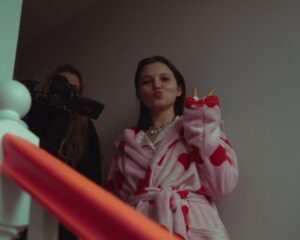 Ella Greenwood Instagram - Smudged Smile is now available to stream (for free) on @stream_klipist - I’m so proud of this wonderful film and so excited that it’s now available for a whole new audience to watch! Starring the very talented @mia_mbruce, the film was created as a way of introducing the topic of Mental Health to young people. This is such a special project, one of my first ever films, made when I was 19 years old with such an incredible cast and crew♥️ 
📷 by @ines_leila_hachou 

Smudged Smile - 
@candid_broads_prod @brokenflamespd 
Director  @popsella 
Writer @hannahrw1 
Producers @oriane_pick @anais.fto 
DOP @xeniaxpatricia 
1st AD @aynoaalvarez 
Production Designer @giorgia_joseph_art 
Hair & Make up @morganemakeup11
Costume @oliviarosehulme

Edited by @editor_emmalie
Grade @lizo_xanh_colourist
Sound design & Mix michalianna
Music @gabyamblercomposer

Casting by @frankie_fearis12

In loving memory of Art Assistant Marina Waldron