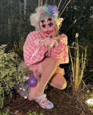 Ellie Diamond Instagram - 🕸️🧚🏻🍄IM BACK FROM THE DEAD🍄🧚🏻🕸️
-
🎶Blue stars runnin on my forehead, cold wings flutterin and moving🎶 So happy to be posting my Portals inspired by the icon @littlebodybigheart ! The album and new aesthetic is a dream! 
-
This look was very fun to make! What you see was all hand sewn, take a swipe thru for the process! I started with a nude hood and added padded “bones” to fill the face then used a fabric to cover it like skin, I then blushed and added dimension with acrylic paint and eye shadows! Eye eye were plastic so I could see thru but only just! I dyed thee hair that was originally blonde. Also the mouth moves like a big puppet which I find haunting ahha! 
-
Thanks for the love on the look and plz tag Melanie! 🍄🧚🏻🥚💋xx