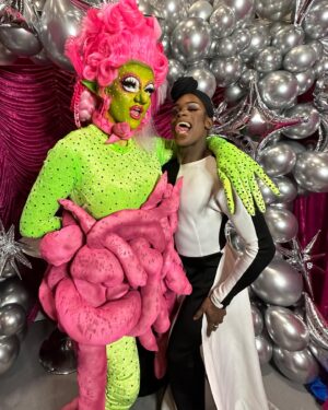 Ellie Diamond Instagram - THE DIAMOND DISCO IN OUTER SPACE🪩👽 Day 1 
**************************************************************************************************
@rupaulsdragcon has been so much fun! Thank you to all who came to my booth yesterday, honestly had the best time with you all!💗💗
**************************************************************************************************
SUNDAY!! last day so there’s still time to come to the disco @ booth #E63! 
*************************************************
Wig by me 
Corset by me 
Catsuit @get_frocked_uk 
*************************************************
(Huge massive thanks to @thrillhausdesigns for creating the stunning curtains for my booth! Aswell thanking @h1c.xx @davidchippa @rosie_zinfandel for helping me with my booth setup)