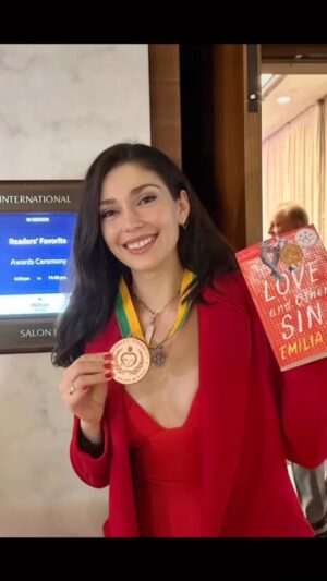 Emilia Ares Instagram - I dedicate this award to my readers, I love you all immeasurably. Everyday, I spend hours and hours, curled over a keyboard thinking of you all. 🥰🫶✨This weekend was surreal—I was awarded the bronze medal by Readers’ Favorite for my debut, young adult, coming of age novel Love and Other Sins. Grateful for this moment and for your heartfelt messages of love and support. You are all so wonderful 🥹 #loveandothersins