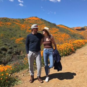 Emily Coutts Instagram - He wanted to hike to the top of the tallest peak. I wasn’t sure he’d be able to but I thought, why not try. We forged a winding path, committed to not hurting a single poppy on the way. We arrived at the peak and sat down for a break. I asked him if he wanted to listen to a meditation about change and letting go, I thought we both could use it. We closed our eyes and listened for 15 minutes, feeling the breeze. When we gently opened our eyes we were surrounded not only by poppies and warm breeze but by hundreds of butterflies dancing around us. We looked at each other, started to smile then laugh. What magic. I will never forget that moment. And now I will picture him there, smiling back at me. Transforming like the butterfly. 

I love you Ken. Rest in peace 🖖🏼