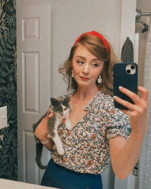 Emily Marie Palmer Instagram - If you haven’t been invested in the Heathcliff Saga, scroll on by — but if you want a very long but very joyful update… here it is. 🐾

One sunny morning last August, we went out to water our garden and were met by a tiny stray kitten. He marched right toward us, meowing the saddest little meow you’ve ever heard. The grass hardly seemed to bend under his meager weight — which the vet later told us was only 1/2 pound. 🥺 

I named the little backyard urchin Heathcliff, and now I will never again listen to Kate Bush’s Wuthering Heights without thinking of those tender, happy Summer days spent nursing this little creature back to health — taking him out on all my garden walks, and letting him sleep in the palm of my hand while I worked. 🥹

From the beginning though, I knew that keeping him was not an option. @joeyciccoline is highly allergic to cats, as are multiple close relatives of ours that we love to host in our home. Even if that weren’t the case, we sometimes have to travel often, and we worried about who we could rely on to care for him. 💔

Fast forward to January. Thanks to the sweet generosity of amazing friends, we had a forever home lined up for little Heathcliff… but things suddenly changed when my highly-cat-allergic sister came to visit. Imagine our surprise when she had ZERO reaction to Heathcliff. We realized that alllllll the allergies Joey had been having off and on had been completely unrelated to him. Somehow this little baby cat that turned up in our yard and stole our hearts ALSO turned out to be a miracle low allergen kitty. 😵

If that was not enough, our dear friend @beckalyn5 has become his beloved home away from home, so we know he’ll be safe   loved whenever we need to be away. 

I know this is a rather long explanation of a rather tiny miracle… but so many of you have been so sweet about following the journey of our little Heathcliff, and I wanted to let you know how things turned out. 

So, it’s official. Heathcliff/Phantom/Ol’ Longbody Ciccoline… welcome to the family! 🥰♥️