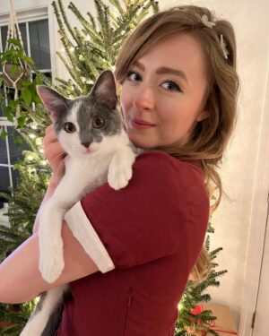 Emily Marie Palmer Instagram - If you haven’t been invested in the Heathcliff Saga, scroll on by — but if you want a very long but very joyful update… here it is. 🐾

One sunny morning last August, we went out to water our garden and were met by a tiny stray kitten. He marched right toward us, meowing the saddest little meow you’ve ever heard. The grass hardly seemed to bend under his meager weight — which the vet later told us was only 1/2 pound. 🥺 

I named the little backyard urchin Heathcliff, and now I will never again listen to Kate Bush’s Wuthering Heights without thinking of those tender, happy Summer days spent nursing this little creature back to health — taking him out on all my garden walks, and letting him sleep in the palm of my hand while I worked. 🥹

From the beginning though, I knew that keeping him was not an option. @joeyciccoline is highly allergic to cats, as are multiple close relatives of ours that we love to host in our home. Even if that weren’t the case, we sometimes have to travel often, and we worried about who we could rely on to care for him. 💔

Fast forward to January. Thanks to the sweet generosity of amazing friends, we had a forever home lined up for little Heathcliff… but things suddenly changed when my highly-cat-allergic sister came to visit. Imagine our surprise when she had ZERO reaction to Heathcliff. We realized that alllllll the allergies Joey had been having off and on had been completely unrelated to him. Somehow this little baby cat that turned up in our yard and stole our hearts ALSO turned out to be a miracle low allergen kitty. 😵

If that was not enough, our dear friend @beckalyn5 has become his beloved home away from home, so we know he’ll be safe   loved whenever we need to be away. 

I know this is a rather long explanation of a rather tiny miracle… but so many of you have been so sweet about following the journey of our little Heathcliff, and I wanted to let you know how things turned out. 

So, it’s official. Heathcliff/Phantom/Ol’ Longbody Ciccoline… welcome to the family! 🥰♥️