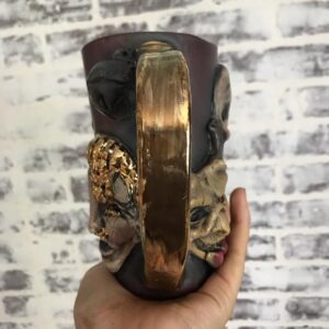 Emily Serpico Instagram - Finished Krampus mug! It has real gold overglaze, and is the only one ❄️ DM if interested #ceramics #overglaze #krampus