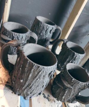 Emily Serpico Instagram - Between throwing orders, I was able to throw a batch of mugs! Some with mushrooms some without! 🌲🍄 #mushroom #treebark #tree #pnwonderland #pottery #ceramics #potterywheel