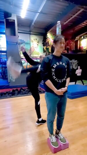 Emily Tung Instagram - It’s a game of trust, and not everyone wins 🥲🤕😂
@lordsetsunia is 6 feet tall so I had to stand on 4” blocks to level the playing field 
.
.
.
.
#martialartist #martialartslife #martialartstraining #martialartsgirls #wushu #wushugirl #wushukungfu #shaolin #shaolinkungfu #kicks #tkd #tkdgirl #tkdlife #taekwondo #trustissues #funnyfails #muaythai #muaythaitraining #stuntgirl #stuntwoman #stuntperformer #stuntdouble #flexiblegirl #highkick #flexibility #roundhousekick #junglegym @brooklynzoony #partnertraining