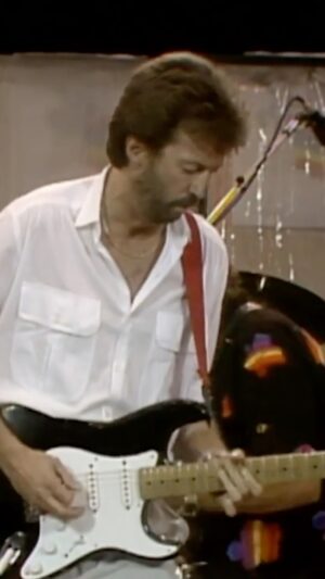 Eric Clapton Instagram - Eric Clapton performing “She’s Waiting” with @officialphilcollins at Live Aid in 1985.