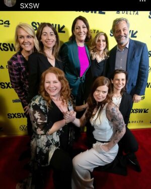 Erin Lee Carr Instagram - AHHH we did it!!!! #Stormy successfully and safely (phew) premiered at @sxsw with Stormy taking the stage to embrace @sarah_silverlake after the film played. it’s an emotional, intense thing to bear witness to all that Stormy has gone though let alone to be her and watch this movie in front of a live audience.
I’m endlessly grateful to @juddapatow for taking this project on and loving it like one of his own films. He (and his wonderful #2 @oliviarosenbloom) pushed us to investigate harder, be braver and yes make the film longer. And although it’s mostly us cheesin (see our incredible producers @sarabdocs @meredithkaulfers @ericaforstadt @steelesds) this film took an absolutely village.
Editors: @inballessner @cutestboyben 
Incredible producer not pictured: Emelia Brown
Supervising Producer: Amanda Rohlke
Co-Producers: @jasonsager, 
Brooke Gadinsky-Snyder, Natalie Goldberg, @oliviarosenbloom 
Composed music: Jeff Marrow
Co-exec producer: Kelsey Field
Story Producer: Jono Zalay 
Archive Producer Extrodinaire: Leah Lani-Griffin 
Cinematography: @shihofukada, Jonathan Furmanski, @wolfganghammer @barrettblade777 
Editorial Consultant: @mbonfiglio2000 
Lead Assistant editor: Moriah Dobos

but only made possible by director @sarah_silverlake 
with love, grit and determination for @thestormydaniels 
On @peacock 3/18

Suit: @aliceandolivia 
Belt: @gucci 
Hair:  Jessica Lindsay (and extensions by @extensionbarla)
Make-Up: Caitlin Krenz 
Accompanied by my prince @malblum