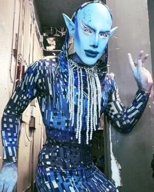 Evah Destruction Instagram - 👽 🛸 Threw together this look to judge last night’s Grackle Games at @oilcansatx. The contestants had to put together a provocative  and enticing Sci-Fi themed look, and they did not play around! 
*I used mostly @mehronmakeup Creme foundation and a bit of the Paradise Paint to cover my head, ears and neck. 
*Blue shadows on my face are from @kimchichicbeauty 2 Queens in 1 Desert Collection and @trixiecosmetics Daytime Realness palette 
*@sugarpill Tako eyeshadow was used generously, and I’m wearing their liquid lip U4EA
*White liner on my eyes is from @nyxcosmetics 🖤
*The glitter on the lip is @urbandecaycosmetics Heavy Metal glitter liner
*The glitter on my forehead is @profanity.cussmetics glitter gel 
*Contact lenses: @moco_queen 🖤