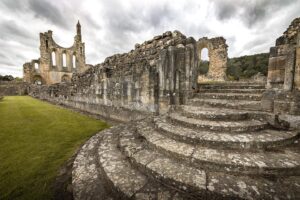 Evelyn Edwards Instagram - Beautiful beautiful Byland Abbey. Riveaulx and Fountains Abbey get so much attention. (And by the way they totally should.  Scroll down a bit in my feed to the Riveaulx Abbey photo. That place is uh-mazing.) Byland felt very special to me. Byland Abbey was 43 years in the making! A group of Savigniac monks founded a monastery in 1128 in Furness Cumberland.  They Abbey was successful enough to take some of the recruits and form a sister house. So 12 monks and an Abbot named Gerold set out to start new Abbey at a place called Calder, a little farther up the coast. That didn’t work out so well as that location was sacked by the Scots army. For the next 40 years the monks moved from location to location.  They ended up adopting the Cistercian rule...there were LOTS of disputes and finally they settled at Byland and built this glorious structure.  Patience is indeed a virtue 
.⁣
.⁣
.⁣
.⁣
.⁣
#bylandabbey #worldheritage #worldheritagesite #northyorkshire #abbey #ruins #architecture #gothic #ruinedabbey #cistercian #monastery #gothicarchitecture #churchesofinstagram #churchesandcastles #churchesoftheworld #middleages #medieval #religious #religioushistory #catholicchurch #ruin #ruined #urbexexploration #urbexuk #historylovers #historybuff #yorkshire #britishphotography #churchmypassion #abandonedplaces