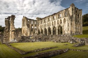 Evelyn Edwards Instagram - I couldn’t help but post a fantastic abbey ruin on the first day of Lent. I didn’t grow up Catholic... but I did go to an all girls private Catholic college for a year before I transferred to UCLA. It was then that I began “giving up something for lent” - usually diet soda or something akin to that. But the Medieval Monk would have gone through a season of fasting and penance that the modern person would shudder at today. Ash Wednesday and Good Friday were “black fasts” with no food consumed at all on those days. On all the other days of Lent food was not consumed until 3pm which was considered “the hour of our Lord’s death.” Water, watered down beer as well as watered down wine were allowed for beverages during the 40 (really 46 days if you count the Sundays) day fasting period. The Monks would not be allowed eggs, dairy, meat, cheese, cream, or animal fats of any kind.  Lent would then culminate with the Triduum: the 40-hour fast lasting from sundown on Maundy ‘commandment’ Thursday all through to the middle of the day on Holy Saturday.  That makes intermittent fasting seem like Mardi Gras if you ask me! .⁣
.⁣
.⁣
.⁣
.⁣
#monk #priory #landmarks #abandoned #britishhistory #rievaulxabbey #abandonedplaces #history #religiousarchitecture #historicbuilding #ruins #lent #yorkshire #visitengland #medieval #medievalarchitecture #historylovers #england #medievalhistory #abbey #catholiclife #englishhistory ⁣#churchphotography #churcharchitecture #medievalcastle #medievalart #medievaltimes