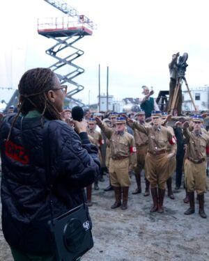Finn Wittrock Instagram - In 1936, a German man, presumably identified as August Landmesser, was photographed refusing to perform a Nazi salute and crossing his arms in defiance.

Swipe to see behind-the-scenes photos of how this shot was recreated in #AvaDuVernay’s ORIGIN.

#ORIGINMovie is now playing in theaters. Get tickets at originfilm.com via the link in bio.