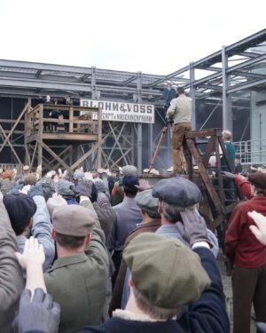 Finn Wittrock Instagram - In 1936, a German man, presumably identified as August Landmesser, was photographed refusing to perform a Nazi salute and crossing his arms in defiance.

Swipe to see behind-the-scenes photos of how this shot was recreated in #AvaDuVernay’s ORIGIN.

#ORIGINMovie is now playing in theaters. Get tickets at originfilm.com via the link in bio.