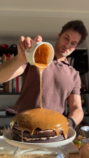 Franco Noriega Instagram - Salted Caramel Mocha Cake

Ingredients:

For the Cake:
1 3/4 cups flour
2 cups sugar
3/4 cups cocoa powder
3/4 coconut oil
2 eggs
Teaspoon baking powder
Teaspoon baking soda 

For the Caramel: 
1/2 cup butter
1 1/2 cups brown sugar
3/4 cup coconut cream
Salt
Vanilla extract

For the Mocha Frosting:
1 cup butter
1 cup powdered sugar
1/2 cup cocoa powder
1/3 cup espresso powder
1 cup cream cheese 
Vanilla extract

Pecan nuts for decoration

Instructions:

1. Bake the Cake. Preheat your oven at 350 F and prepare your cake pan
2. Combine your dry cake ingredients, then add wet ingredients and mix until you have a smooth batter
3. Pour the batter into the pans and bake for 25 minutes or until a skewer inserted into the centers comes out clean and allow the cake to cool

4. Caramel Frosting
Melt butter in a saucepan, add brown sugar, cream, and bring to a boil, stirring until the sugar dissolves
5. Add salt and vanilla and simmer until you get a semi thick consistency
 Use this frosting to top of the cake 

6. Mocha Filling
Cream butter in a mixer, then gradually add powdered sugar, cocoa powder and cream cheese. Add the coffee powder and vanilla and beat until light and fluffy. Use between all layers of the cake