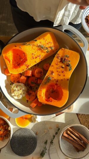 Franco Noriega Instagram - My favorite soup in the winter is butternut squash, here is my quick version of it!

Ingredients:
1 butternut squash
Rosemary or thyme 
2 carrots, diced
1 head of garlic
Olive oil
Salt and pepper
1 tbsp butter 
1/2 chopped onion
1/4 tsp turmeric powder
1 tsp peperoncini
1 tsp pumpkin cinnamon 
3 cups chicken or veggie broth
1 tbsp butter at the end

Procedure:
1. On a baking sheet, place the halved butternut squash (remove seeds), carrots, rosemary, and garlic.
2. Cut the top of the garlic head to expose the cloves, add olive oil, and wrap in aluminum foil.
3. Drizzle olive oil, salt, and pepper over all the vegetables and bake at 350 degrees F for 45 minutes.
4. Once out of the oven, peel the squash skin or scoop out the pulp with a spoon.
5. In a pot, melt butter, sauté onion. Add turmeric, cinnamon, peperoncini, sauté for a few minutes. Add squash, carrots, squeeze in roasted garlic, season with salt and pepper. Cover with chicken broth, then using an immersion blender, blend until smooth, or blend in batches in a regular blender.
6. Bring the soup to a boil, reduce heat, and simmer for 15 minutes
7. Decorate the soup with olive oil, and Parmesan cheese