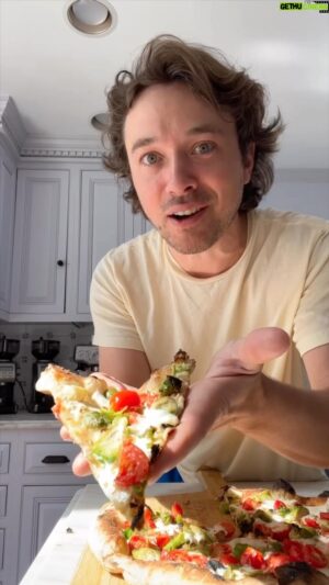 Frankie Celenza Instagram - Pizza is something I’m always excited for. The secret to a really great pizza is a really hot oven. Ooni pizza ovens can reach temperatures as high as 950ºF almost double what your home oven can do. So, if you’re ready to take your pizza game to the next level - this is the tool you need!  
#oonipartner 
 
Frankie’s dough, makes three 330 gram balls
585gr bread flour
35gr whole wheat flour
2gr or 1/2tsp instant/rapid rise yeast
18gr kosher salt
375gr water
 
Add all ingredients to a stand mixer set to low and knead for 10 minutes. 
Move to an oiled bowl or container with a lid, let rise at room temp for 3 hours, then place in fridge. Let it rise in the fridge for at least 12 hours and up to 3 days.
Weigh and form 3 balls (333gr each), put them each in their own container, place back in the fridge. (4 hours)
Remove 3 hours before use. Room temp dough stretches easier.

@oonihq