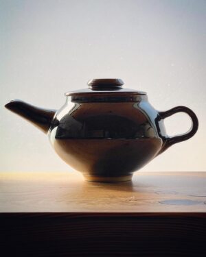 Freddie Wong Instagram - I decided last year when I started to have one shot at a teapot every March as a sort of “test” of my skill progression. This is the latest (lid mad loose, had to pull a handle due to my sense of proportion for a hump thrown handle being way off). Second picture is of my first teapot test. Definitely improving, but gotta keep going!