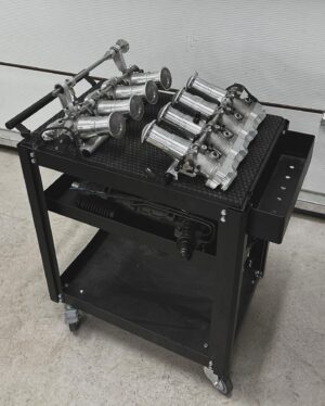 Fredric Aasbø Instagram - Aaand here’s the engine for the AE86 Corolla: A #TeamToyota 3UZ Lexus V8 on ITBs!

Some of of you guessed the motor when I first posted about the car - well done! These photos are of a first mockup and the plans are as follows:

- @kelfordcams (medium spec for good torque, factory pistons and retaining VVTi, 264 or 272 degrees duration)
- @mywireshop ultra nice custom race harness for MaxxECU, with new double TPS connectors, OBD-port, etc.
- @pmcmotorsport adapter kit and flywheel for ZF transmission
- @tenacimotorsport 240mm clutch and sprung disc for great driveability and reliability
- @xat_racing S65 ITB adapters
- Custom press fit ITB velocity stacks from my Uruguayan friend @fernandomontero_oficial
- Underdrive powersteering and alternator setup using parts from UZ mastermind @hughesracebuilt 
- @eneosusa Street 0W-50 motor oil, which is also what we run in Formula Drift

The engine itself was sourced by my friends at @garage_d_official and it’ll be fully built by my friend @dag_johnson using OEM parts from @toyota_norge. @maxxecu tuning by @jonusracing and fab work by @vtssolutions. Really excited for this build!