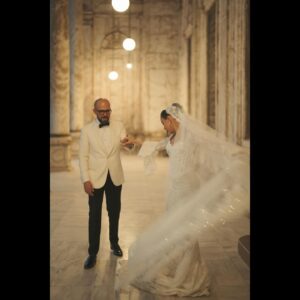 Gamila Awad Instagram - Words can hardly express the overwhelming joy and love I felt on our wedding day. Yesterday my dream came true being surrounded by most loved gang who made all the difference. As if a fairytale from my childhood, I found myself on the historic Citadel overlooking this beautiful city, my soulmate Ahmed by my side and surrounded by our beloved family and friends, many of which being the talented and acclaimed icons of the region. Our night encapsulated something I could only dream of and yet we witnessed a night filled with magic that one can only wish for.
From the breathtaking views of Cairo’s skyline to the exquisite decor by @thenottstudio and the captivating performances, every detail was perfectly curated by the incredible @thecarouselworld team. My heart is full of gratitude for the talented Rami Kadi, who crafted my regal gown, and for the exquisite jewelry by Amgad Ghaly. The remarkable bridal look by the magical hands of Reham Khalifa via @diorbeauty, Yasmine Kenawi, and Al Sagheer Salons.
Thank you to everyone who made this day possible and to all who graced us in the happily ever after of this fairy tale wedding, which for me and Ahmed is just the beginning of our journey together. 

Event Planning & Management | @thecarouselworld 
Art Direction & Production | @thenottstudio
Bridal Couture | Rami Kadi @ramikadi
Jewelry | Amgad Ghaly @amgadghalycollection
Stylist | Yasmine Kenawi @yasminekenawi
MUA | @rehamkhalifaa with just @diorbeauty
Hair | @mr.bishoo @alsagheersalons
Wedding Photography | @mangaawyowes 
Wedding Videography | @risha.films
Lighting | @prolite.eg 
Candles | @lumiere_candles_egypt
Catering | @thesagexperience
Cocktail service| @hummingbird 
Special Thanks | @st.regiscairo @salahaldincitadel @waleedsalahz 

All the love and gratitude to our best friends and family @tamermortada @ahmadalmorsy @daliahgalal  @aboutgigi_ @leenaelmasry @aromastudios no words can do justice!