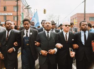 George Soros Instagram - On March 25, 1965, Dr. Martin Luther King Jr. led thousands from Selma to Montgomery, Alabama to campaign for African American voting rights. Linking arms with King are John Lewis, Reverend Jesse Douglas, James Forman, and Ralph Abernathy.⠀
⠀
Today on Martin Luther King Jr. Day, his legacy reminds us that in an open society we must always strive for racial equality and ensure that our governments are accountable to all citizens, regardless of race.⠀
⠀
Photo credit: © Steve Schapiro/Corbis/Getty⠀
⠀
#opensociety #mlk