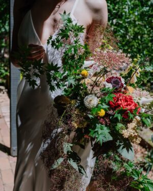 Geraldine Hakewill Instagram - When Mark and I surprised our family and got married over Christmas I was very lucky to have my 11th hour dress made for me by my friend @biancaspender 🌸 It was like a second skin and it helped me feel effortlessly glam and special. She is releasing a new bridal collection soon and you could wear your very own creation down the aisle/forest path/jetty… I can highly recommend.
Mark had his linen suit custom made by the amazing @annacordell_ and we both wore our @rmwilliams boots. Our local flower farm made my bouquet @fleurs_de_lyonville and a beautiful neighbour and now friend @clairderwortphotography took our photos. Another friend @i_am_jika made our rings from recycled gold. 
I did my own hair and make up which the wind and my tears quickly made short work of. I got sunburnt shoulders and felt giddy and couldn’t stop smiling all day.