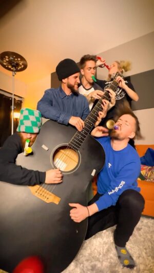 Giancarlo Nicassio Instagram - What song should we perform on the big guitar next??? #carryonmywaywardson