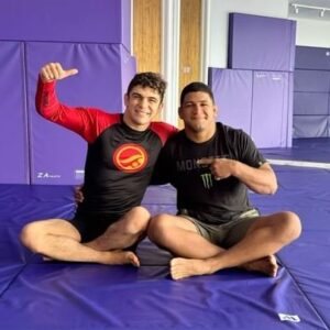 Gilbert Burns Instagram - LEARNING FROM DURINHO ! Learning how to punch correctly from the man who gave me my black belt @gilbert_burns . Over 14 years of us training together, since I was about 13; he has been such a big mentor for me teaching me so many of the values and discipline I have today! I still hear in my head him yelling at me when I was tired when I was younger. “I DONT CARE!!! KEEP GOING.”🤣😭❤️