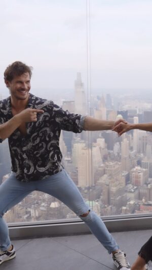 Gleb Savchenko Instagram - Oh hey! 🕺 One of my fans from SALSA IN THE SKY is getting married so I gave her a quick dance lesson on the sky deck. Congrats 🥳

Click the LINK IN MY BIO to WATCH the full SALSA IN THE SKY video 🪩