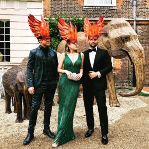 Graham Phillips Instagram - Such a fun time at #theanimalball with @lizgillz & @rafaeldlf. An eye opening and important eve reminding us that in this new era of cohabitation with the animal kingdom, it’s more crucial than ever for us to take steps to preserve the wild and natural that remains or our kids and grandkids will be reading about elephants and rainforests in their history books. Cheers to Elephant Family for orchestrating, Prince Charles and The Duchess of Cornwall for hosting, and @juliahaart  for the invite and the exquisite mask design. It was a delight to meet you and fly around the ball with our crew of phoenixes. 🔥🦚🎩