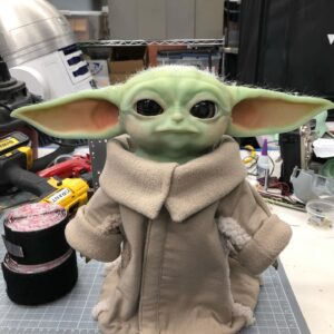 Grant Imahara Instagram - Pleased to present my newest creation: a fully animatronic Baby Yoda. It’s been three months of hard work and countless revisions. He’s a personal project that I started in early December. I did all the mechanical design, programming, and 3D printed the molds. He’s currently running a continuous sequence, but soon I’ll be able to trigger specific moods and reactions, as well as incorporate sound. Special thanks to @saltiesthime for creating the silicone skin, painting and hand-punching the hair, @misslindsayxoxo for the coat and jumpsuit, and Project 842 for the incredible digital model. This is a not-for-profit project. We’ll be touring children’s hospitals and our first visit is scheduled for April!
