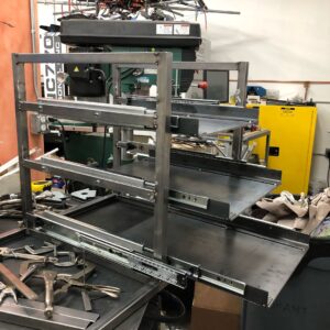Grant Imahara Instagram - Designed and built this rack for my scrap aluminum stock. Fits in the space right under my lathe and has high-capacity drawer slides so the bins roll out smooth.