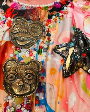 Grayson Perry Instagram - Overdoing it tonight, spooky Alan Measles dress by #CSM student Rosie Crompton, super sweet bag by @SOPHIAWEBSTER brooch @AndrewLoganAMW 
Mad stare, model's own
