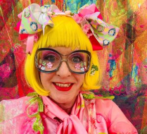 Grayson Perry Instagram - Put together my look round my new sparkly Sophia Webster bag, dress by Chao Li @UAL student