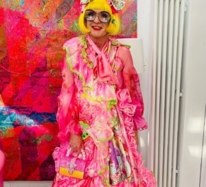 Grayson Perry Instagram - Put together my look round my new sparkly Sophia Webster bag, dress by Chao Li @UAL student