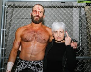 Gregory Marasciulo Instagram - me and mom standing in front a chain link fence 

photo by @brainbuster_