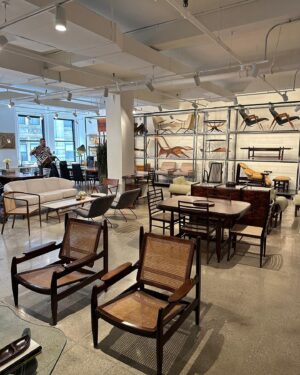 Gustavo Naspolini Instagram - Today I came to visit Found Collectibles @foundcollectibles , a beautiful gallery with curated mid-century Brazilian furniture and decor! I got stunned by the gorgeous pieces they have, like this Jangada chair i’m sitting on in the first picture! It’s located in the Garment District in Manhattan! Congrats @jfrancesstudio @rodrigosalem for the amazing work!!! 😍🤍👏🏼 #homedecor #nyc #furniture #interiordesign