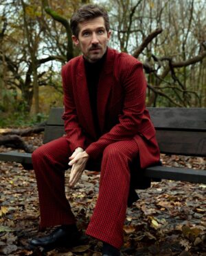 Gwilym Lee Instagram - I wore a bright red suit and traipsed through the woods to chat to the guys @coolamericamag about @thegreathulu, acting, kindness and not being cool…amongst other things. Thanks for having me along. 

Photographer: @jemimashoots 
Styling: @gregory_russill @gary_represents 
Grooming: @charlieculleneducation 

#thegreat #coolamerica #hulu
