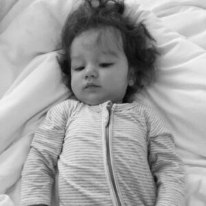 Hanna Mangan Lawrence Instagram - Our little bed warmer 🧡 I’m finding it hard to believe that our little guy only has a week left until he turns one! WOW! What an incredible gift we were given last year, it’s a cliche, but NOTHING could prepare us for parenthood. The highest highs and definitely some lows. We’ve had to make big decisions that affect the well-being of a real life human - that alone is terrifying at times. From the moment he came out, it’s been go go go. He has been the most incredible little guy to watch grow - so confident and outdoing. The last month he has perfected his dance moves and loves to show them off at chance he gets. His body takes over and he gets lost in the rhythm. He’s a cuddly boy but independent . He couldn’t wait to start walking and definitely don’t try to get him to sit down when he doesn’t want to. He’s fearless - conquering the slides at parks and performing flips with me. He’s always on a mission and completes it while humming sweet tunes to himself. He LOVES blueberries. But loves playing with his Pappa more - his first word was “Dada”. He is everything we ever wanted, sometimes we need to pinch ourselves just to make sure this is real life! We love you our little Romi! Thanks for being such a bright and shining light in our life. And thanks for our morning cuddles (and face slaps)🧡💛