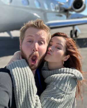 Hannah Bamberg Instagram - Did I make Ian shave his beard after I saw this picture…yes, yes I did. Swipe to see the winter version of Ian🧔🏼‍♂️🥶☃️ 

Any guesses where we are off to? ✈️