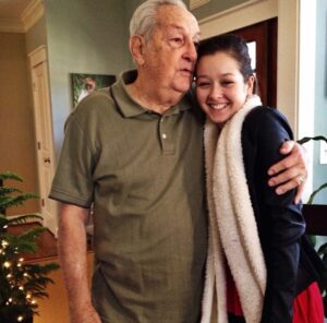 Hannah Bamberg Instagram - This is one of my favorite pictures ever. I had asked my grandad to take a picture with me, and instead he started singing to me. He loved Nat King Cole, and I would regularly hear him sing Mona Lisa or When I Fall in Love. He had a good voice. There was a season where I would spend my Thursday nights at his house sitting at his kitchen table while he taught us about the tabernacle, the old testimony and the Greek. He would regularly share the gospel with strangers, give out hundred dollar bills and ask you what you needed. I know today in heaven as he stands face to face with Jesus he is welcomed by my grandmother, and all the ones he led to Christ through the years. I’m so proud to be his granddaughter and a part of the Blaising family. But I’m most proud of being able to carry on his legacy of loving people and sharing the gospel.
