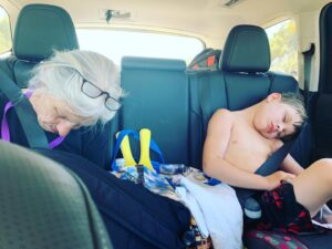 Heather Tom Instagram - In stereo... #missionaccomplished end of the #beachday #nap #nana #grandma #grandson #knockedout #beach #sun #fun