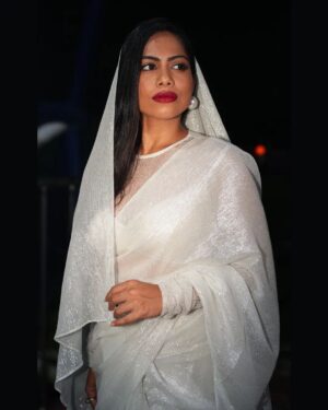 Henna Bella Instagram - @hennabella_4 as the November Bride.

Wearing a Silk Georgette saree with silver zari and a lace high-neck blouse from @saltstudio 

Paired with over-sized pearl earrings from @dhora_india and a silver finger ring with red stones from @amrapalijewels Both these pieces of jewellery are available at the @saltstudio Kochi store.

I would recommend this Indian Christian bridal look for an evening wedding. The shimmery saree would work brilliantly for night-time photography. The pallu can be draped over the head and doesn't require an additional veil. The saree itself is lightweight and offers an ease of wear that heavily embroidered sarees and kanchipurams don't.

Outfit: @saltstudio 
Photography: @___.r_e_d.___ assisted by @the.najose 
Concept, Creative Direction and HMU: @priyamaudlin
Assisted on Hair by @enchantbyeapen 

#nighttimephotography
#bridalportraits
#bridalmakeupkochi #bridalmakeupkerala #keralachristianbride #keralamakeupartist #kochimakeupartist #flashphotography