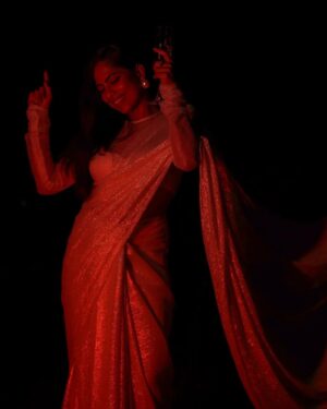 Henna Bella Instagram - @hennabella_4 as the November Bride.

Wearing a Silk Georgette saree with silver zari and a lace high-neck blouse from @saltstudio 

Paired with over-sized pearl earrings from @dhora_india and a silver finger ring with red stones from @amrapalijewels Both these pieces of jewellery are available at the @saltstudio Kochi store.

I would recommend this Indian Christian bridal look for an evening wedding. The shimmery saree would work brilliantly for night-time photography. The pallu can be draped over the head and doesn't require an additional veil. The saree itself is lightweight and offers an ease of wear that heavily embroidered sarees and kanchipurams don't.

Outfit: @saltstudio 
Photography: @___.r_e_d.___ assisted by @the.najose 
Concept, Creative Direction and HMU: @priyamaudlin
Assisted on Hair by @enchantbyeapen 

#nighttimephotography
#bridalportraits
#bridalmakeupkochi #bridalmakeupkerala #keralachristianbride #keralamakeupartist #kochimakeupartist #flashphotography