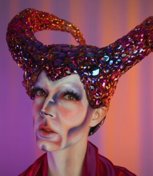 HercuSleaze Instagram - I’m entering a new era of my drag 💜For a year after the tv show aired I was able to pay my bills by performing & teaching drag, and with the occasional sponsored post. I felt lucky to be able to turn my passion into a career but the increased attention that came with it made my anxiety skyrocket! I felt tied to the treadmill of maximizing the exposure I’d received and it stripped away a lot of my love for the artform. This year I’ve been processing that pressure and those high expectations, and I’ve been taking space back in my life for Meags. I’m finally at a place now where I’m at peace about doing just what I can and only what feels good. My goal is to make looks that interest me and to perform acts that make my friends laugh. If I can still book the occasional well paying gig here and there, I’ll be grateful for those opportunities! 💜 Hooray for improved mental health!

😈 Headpiece by me
📸 Photography by me

#dragking #dragkings #dragartist #canadiandragking #canadiandrag #dragphotography  #dragqueen #malecontour #dragkingmakeup #femmeking #montrealdrag #dragmtl #canadiandragking #canadiandrag #instadrag #dragphotography #androgynous #genderbender #performanceart  #queerart  #dragkingsofinstagram #dragkingvisibility #alldragisvalid #canadianmua