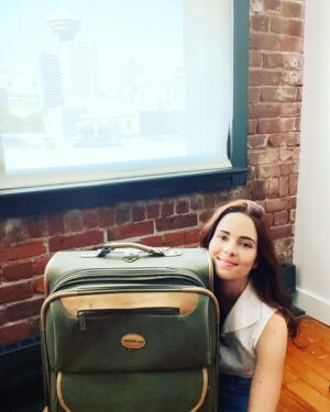 Holly Deveaux Instagram - This is my favorite old suitcase. I bought it twelve years ago when I had to travel for a film shoot for the first time. We’ve been through so many airports and hotels together.

I have to get another one because I have far too many books to fit, and this guy is overdue for retirement. I’m sending it to a lovely suitcase farm where the suitcases get to roll across the fields in the sunset.

I’ll miss you, old boy.